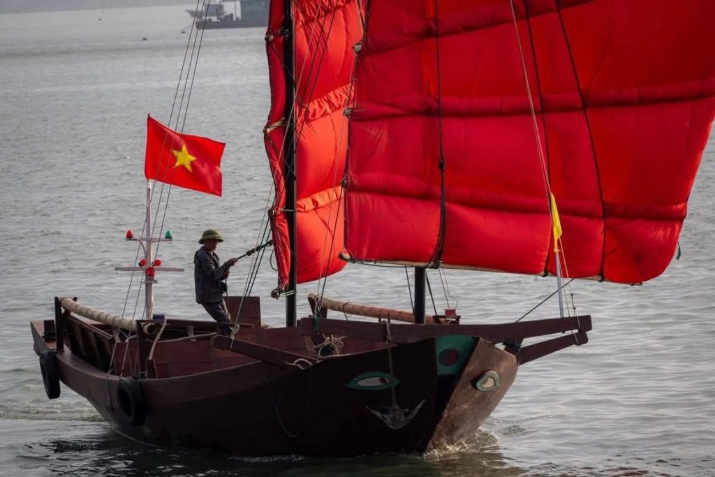 Red Sailboats in Halong Bay Bring Traditional “Ba Vach” Boats Back to Life